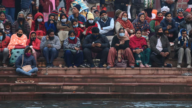 Hindu devotees attend evening prayers on the banks of the River Ganges on January 13.