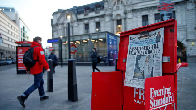 The front page of the Evening Standard newspaper leads with the story that the government is contemplating making it compulsory that all visitors to the UK will have to quarantine in a hotel, after arriving here, outside Victoria train station in central London on January 25, 2021, as Londoners continue to live under Tier 4 lockdown restrictions. - The UK government faced growing pressure on Monday to detail a strategy to reopen schools in England, following a backlash from lawmakers about reports they could remain closed for months. (Photo by Hollie Adams / AFP) (Photo by HOLLIE ADAMS/AFP via Getty Images)