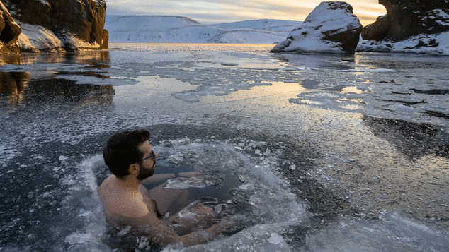 A participant baths in the waters of an ice-covered lake in southwestern Iceland during a seminar on February 1, 2020 in Kleyfarvatn, near Reykjavik. 