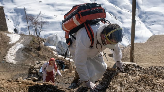 Doctor Akay Kaya, right, and a nurse Yildiz Ayten from the Bahcesaray public hospital, arrive in the remote village of Guneyyamac in eastern Turkey, to vaccinate residents aged 65 or over with the Sinovac CoronaVac Covid-19 vaccine, on February 15, 2021.