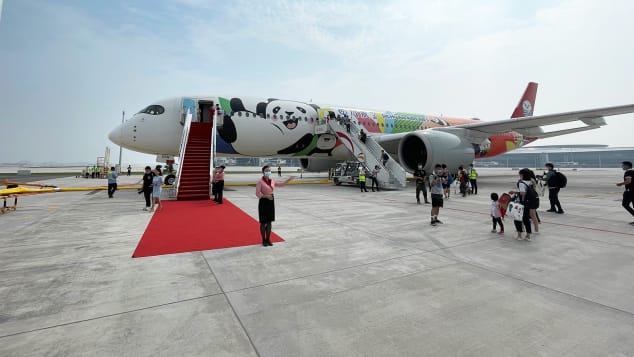 Passengers prepare to board an airplane at Chengdu Tianfu International Airport on June 27. 