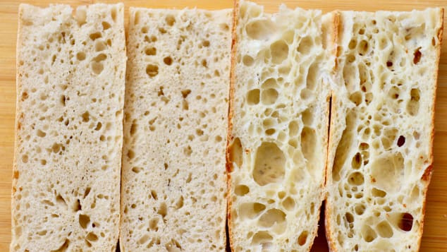 Irregularly shaped holes, a term referred to as "alvéolage," are characteristic of artisanal bread, right. Supermarket baguettes, left, don't have the same interior.