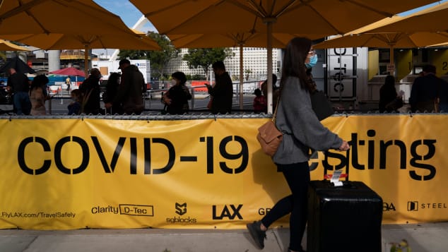 Travelers queue for Covid-19 tests at Los Angeles International Airport.