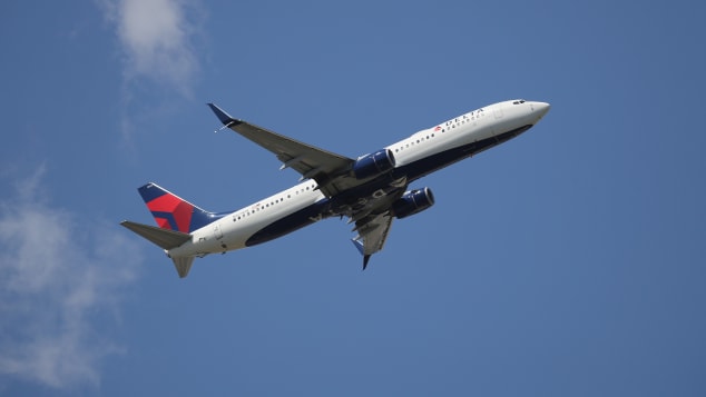A Boeing 737-932ER operated by Delta takes off from JFK International Airport. AAA says only about 7% of people traveling for the July 4 holiday will be flying.