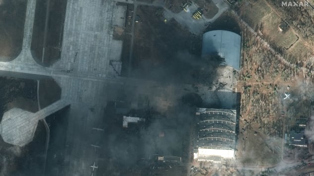 Satellite images from Maxar Technologies show significant damage to part of the hangar at the Hostomel Air Base where the AN-225 is stored.