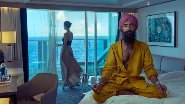 This photograph by Annie Leibovitz shows Sikh-American actor, designer and activist Waris  Ahluwalia mediating in a cruise ship stateroom. 