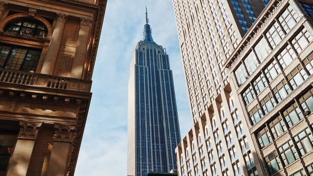 The Empire State Building looms high in New York City and in the minds of travelers.