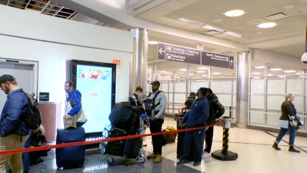 Customers wait to rebook their Southwest Airlines flight at Hartsfield-Jackson Atlanta International Airport on Monday.