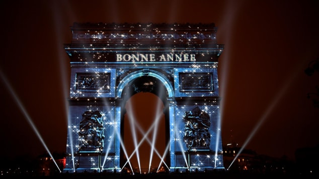 The Arc de Triomphe was illuminated by a laser display reading Happy New Year in 2017.