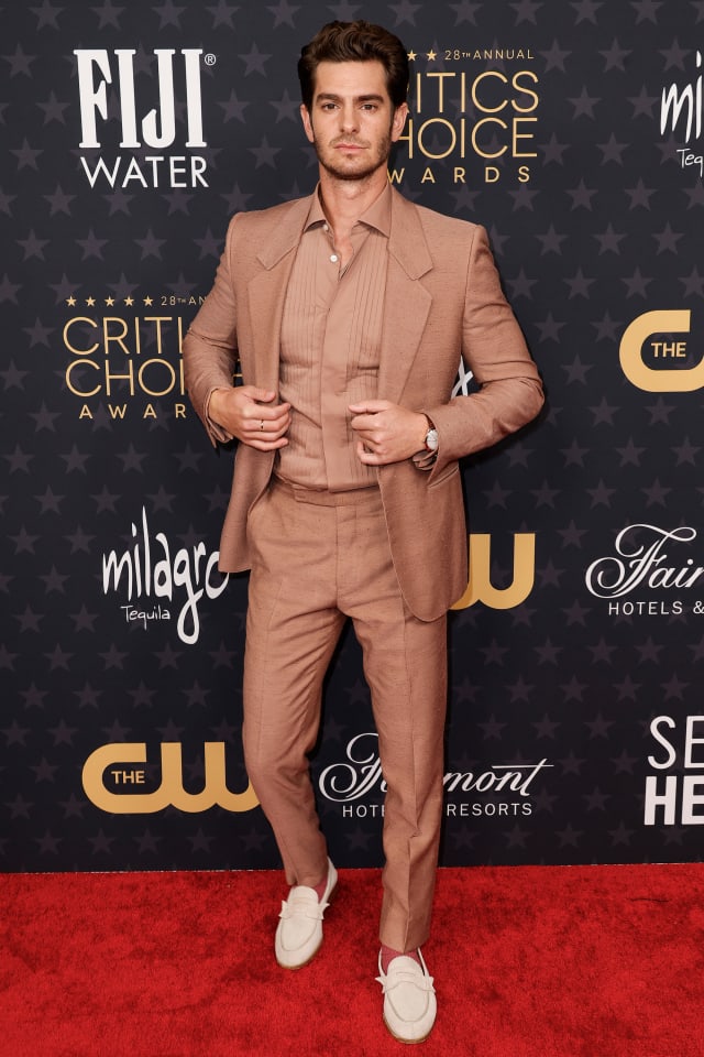 Andrew Garfield paired his camel-colored Zegna suit with an Omega watch.
