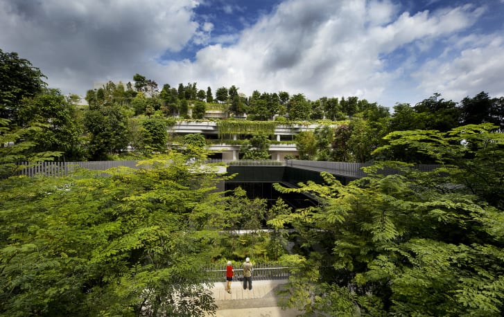 The building's design includes public gardens and terraces.
