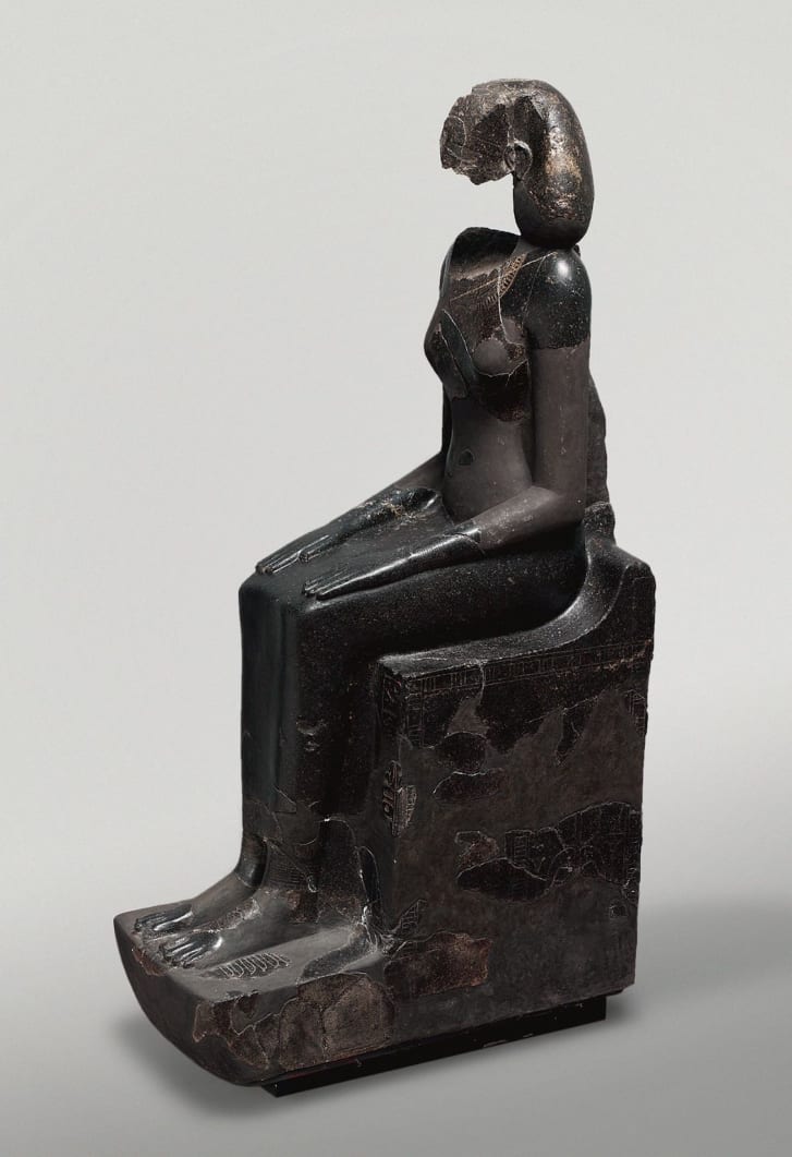 A statue of the Egyptian queen Hatshepsut wearing a "khat" headdress.