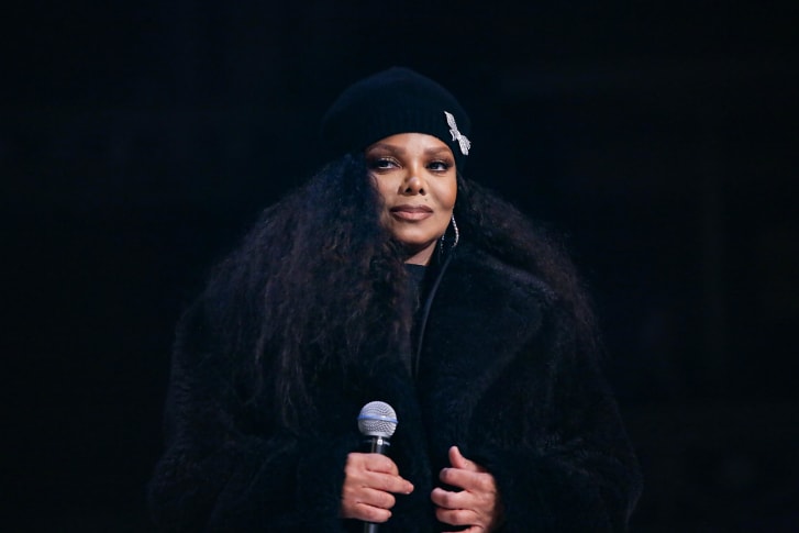 Janet Jackson on stage wearing Stella McCartney.