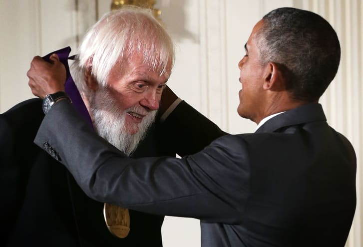 Then US President Barack Obama presents the 2014 National Medal of Arts to John Baldessari at the White House.
