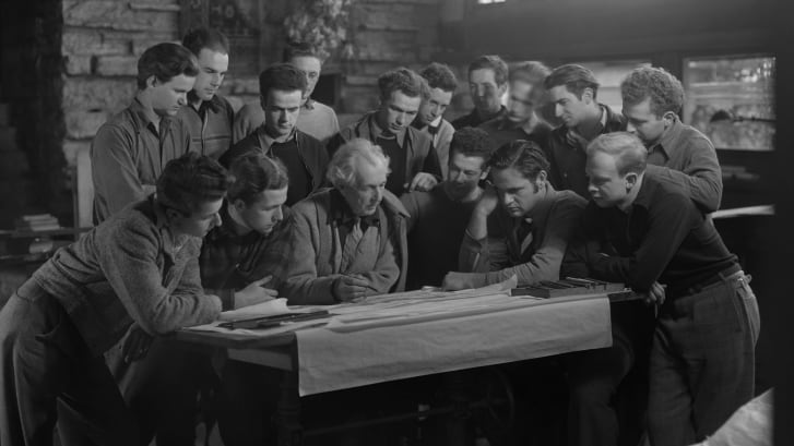 Frank Lloyd Wright pictured at a drafting table at Taliesin, in Spring Green, Wisconsin.