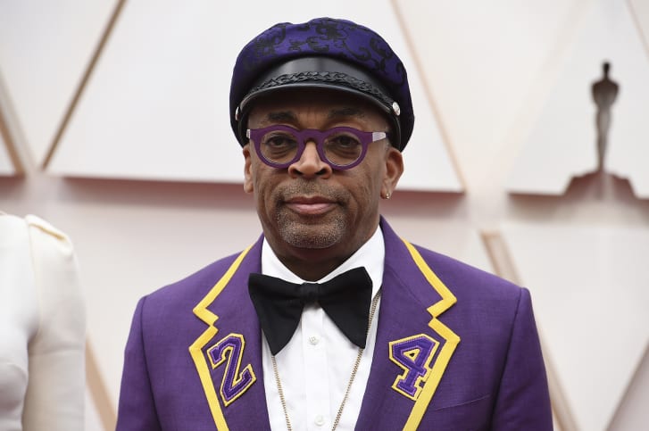 Spike Lee paid a colorful tribute to Kobe Bryant in a purple-and-gold Gucci suit marked with the late basketball star's jersey number, 24. 