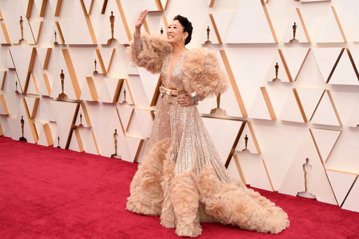 Sandra Oh's nude pink gown (pictured) to the brighter shades worn by Idina Menzel and "Parasite" actress Park So-Dam.