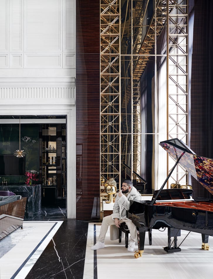 Drake in his Toronto home next to a bespoke Bösendorfer concert grand piano, designed by Ferris Rafauli and Takashi Murakami. 