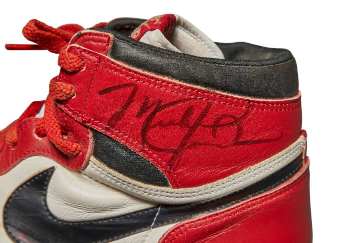 Michael Jordan's signature is featured in permanent marker on one of the shoes.