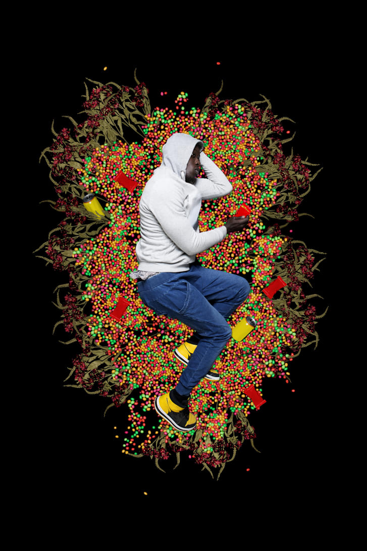 Diop represents each story of Black resistance through allegorical portraits. In this image, he plays the role of young Trayvon Martin, who was wearing a hoodie and had just bought a pack of Skittles when he was class=