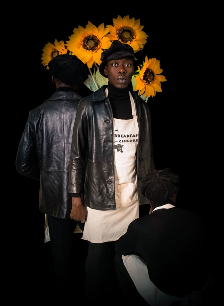 Diop as a member of the Black Panther Party, whose founders Huey P. Newton and Bobby Seale started the movement with community service outreach including a free breakfast program for class=