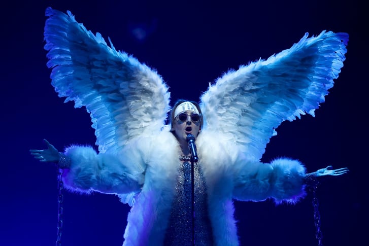 Tix sings "Fallen Angel" while dressed the part.