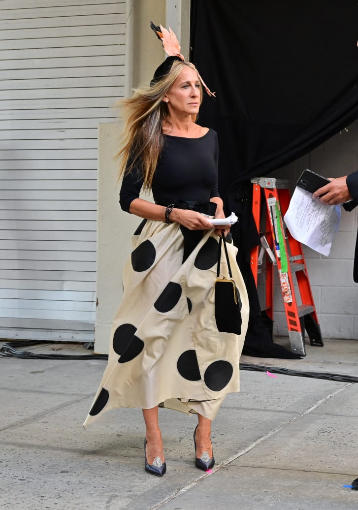 Sarah Jessica Parker on the set of "And Just Like That..." this August wearing a Carolina Herrera skirt.