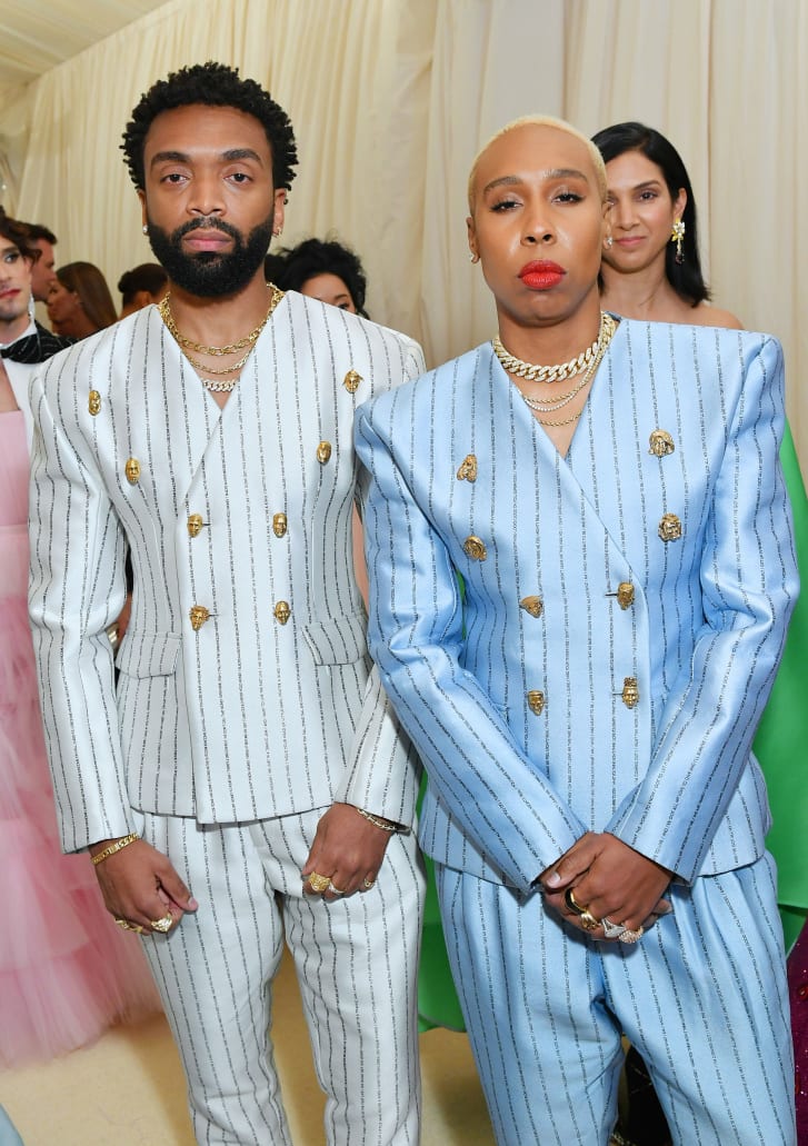 Pyer Moss founder Kerby Jean-Raymond and actor Lena Waithe both wearing suits with custom Johnny Nelson buttons to the 2019 Met Gala.