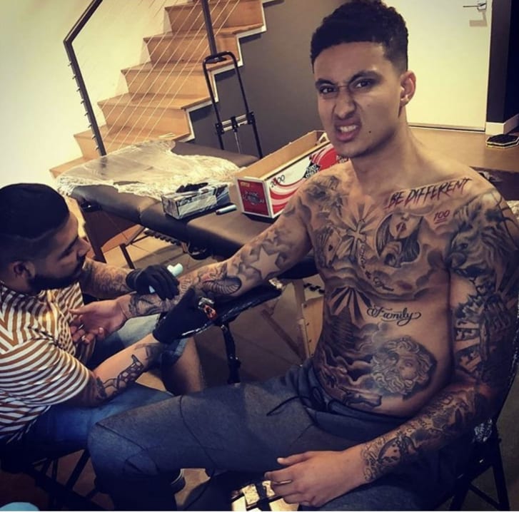 Kyle Kuzma gets tattooed by Carrasco.