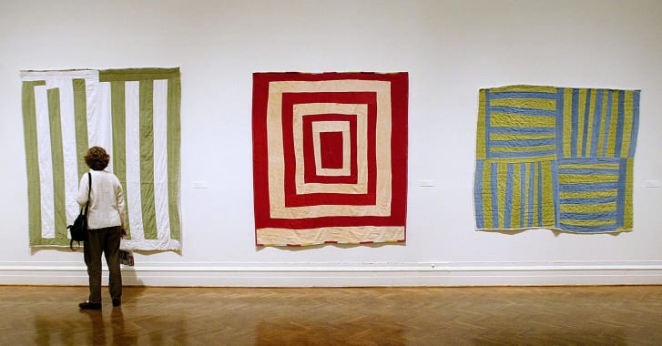 A visitor looks at the "The Quilts of Gee's Bend" exhibit at a 2004 show in Washington, D.C.