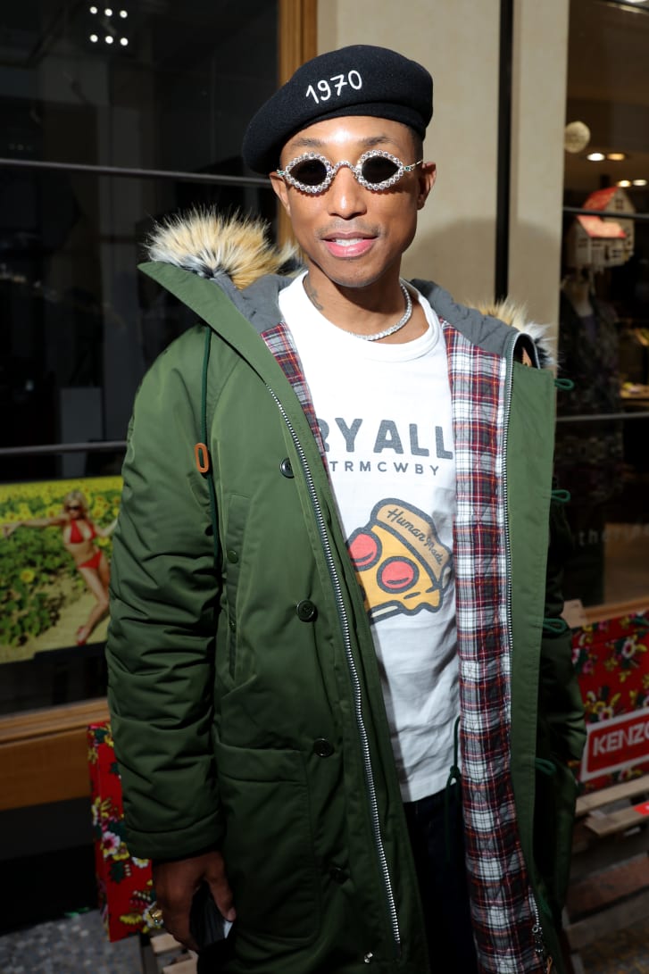 Pharrell Williams at the Kenzo show wearing a pair of Tiffany & Co. sunglasses.