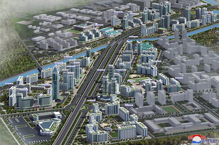 A 3D visualization of the development shows a tall skyscraper on the left, with other towers lining a wide street.