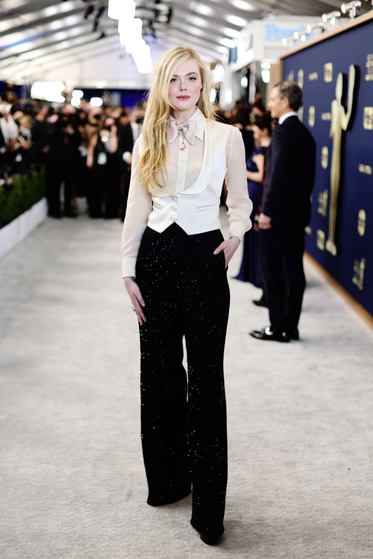 Menswear-inspired outfits were a popular choice for women on the red carpet and "The Great" star Elle Fanning followed suit, wearing a sheer top, sparkling pinstriped trousers and a silk waistcoat and bowtie.