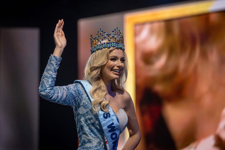 Miss Poland Karolina Bielawska waves after winning the 70th Miss World beauty pageant.