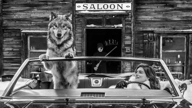 A 2019 shot of Cindy Crawford with an interesting passenger riding shotgun, taken in Nevada City, Montana. "I've worked with Cindy a lot," Yarrow said. "She's brilliant. This was the first time we actually worked with each other. You need to tell a story. So you've got the guy behind as well as her and the wolf. You need to have more than one layer."