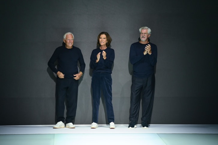 Giorgio Armani (left), his niece Silvana Armani (middle) and Leo Dell'Orco (right) take a bow after Emporio Armani's Spring-Summer 2022 show at Milan Fashion Week last year.