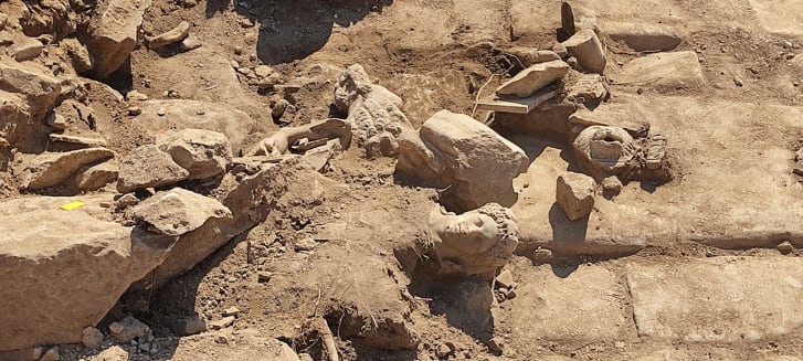 Fragments of the statue are shown at the dig site in Philippi in Greece. Hercules was renowned for his extraordinary strength from a young age.