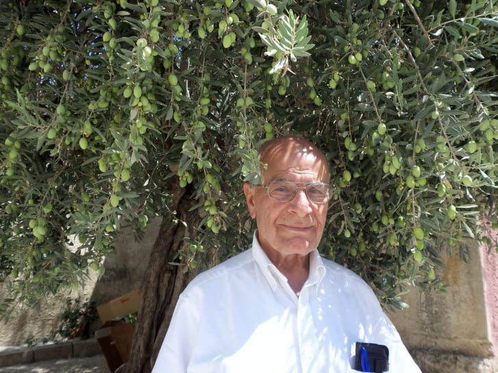 Mahmoud Salah poses during a recent trip to the West Bank. When possible, Salah visits what remains of Sar'a, the Palestinian village where he once lived.