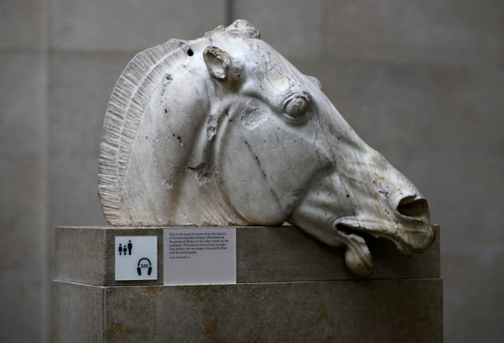 The Head of a horse of Selene, part of a collection of stone objects, inscriptions and sculptures, known as the Elgin Marbles, is displayed at the Parthenon Marbles' hall at the British Museum in October 2014.