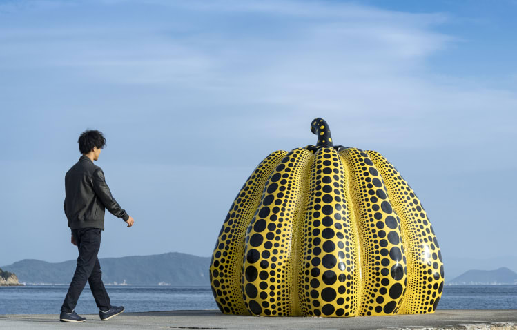 Yayoi Kusama's six-foot-tall, eight-foot-wide pumpkin was sadly swept out to sea by a typhoon in 2021. 