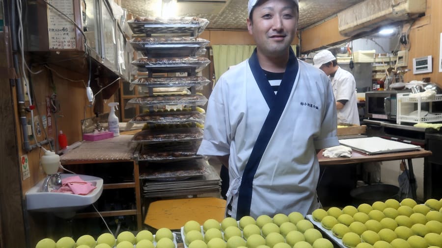 Koike Kzunari is the fourth generation of Koikekashiho, a pastry shop in Yanaizu that has been making Awa Manju (sweet bean paste inside millet buns) for 100 years. Photo by Beth Reiber