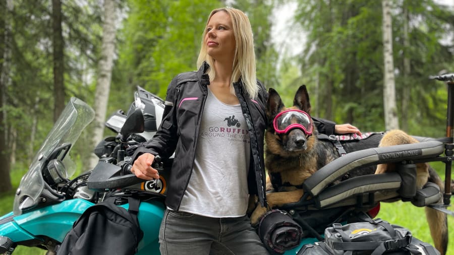 01 woman riding motorcycle around the world with dog AK