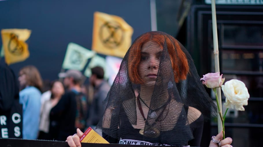 Extinction Rebellion protest at London fashion Week. Protesters from Extinction Rebellion demonstrate outside the BFC Show Space, London. Picture date: Tuesday September 17, 2019. Photo credit should read: Isabel Infantes/PA Wire URN:45330330 (Press Association via AP Images)