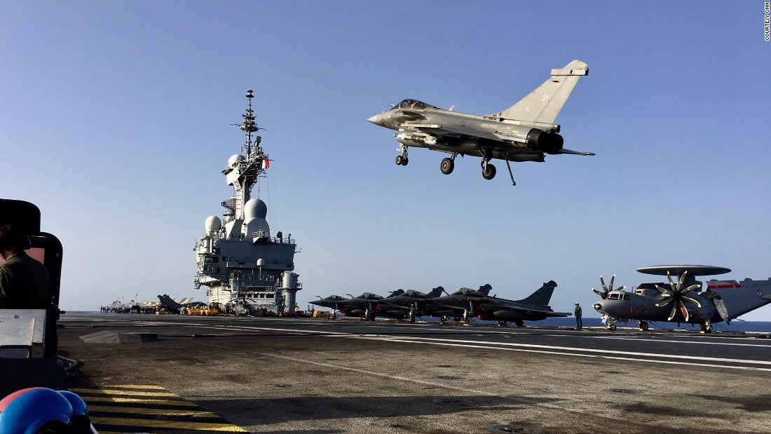 Two US sailors assigned to French aircraft carrier hit by pandemic outbreak test positive for coronavirus