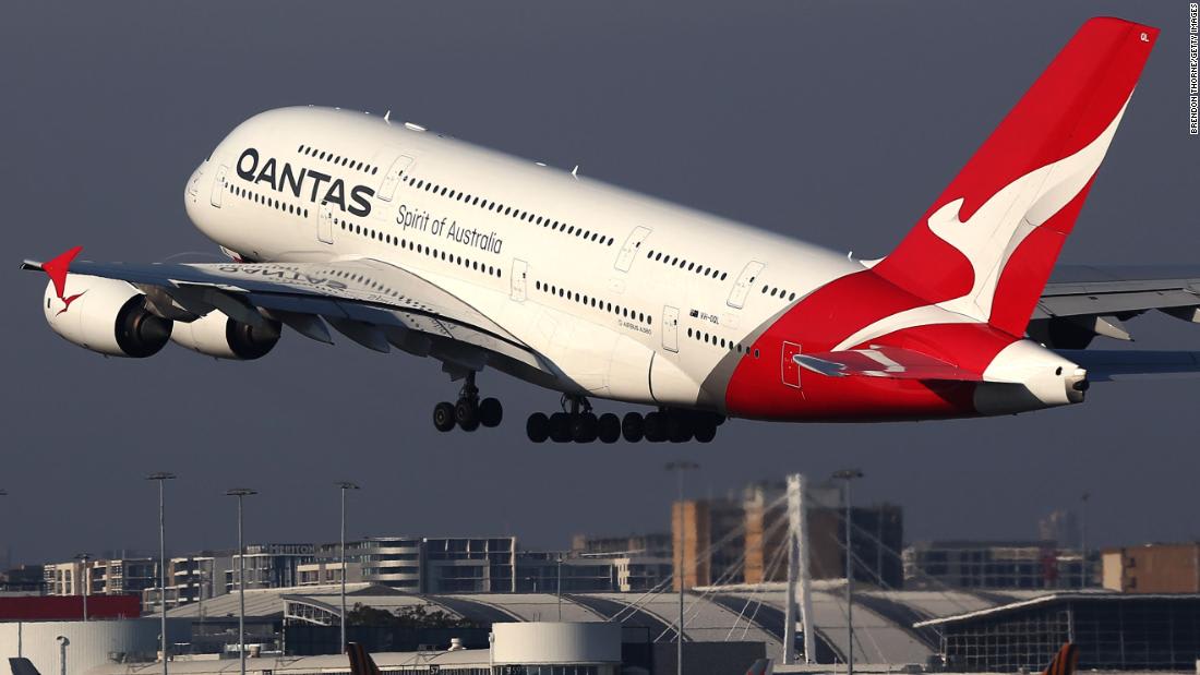 Qantas cuts almost a quarter of all flights and says its CEO will stop taking a salary