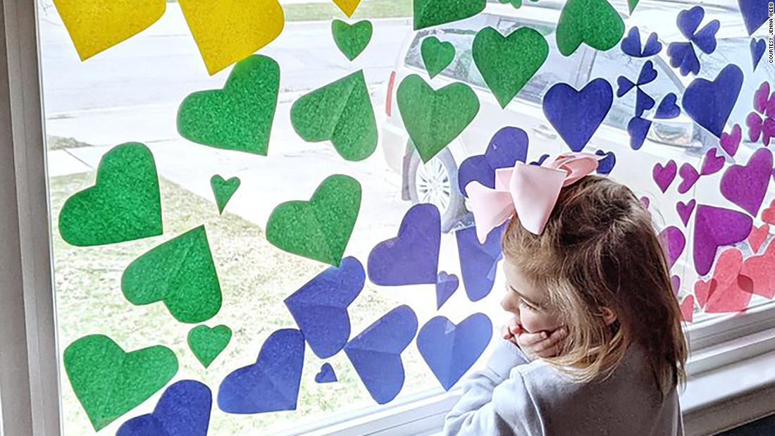 People are decorating their windows with hearts and messages of hope right now