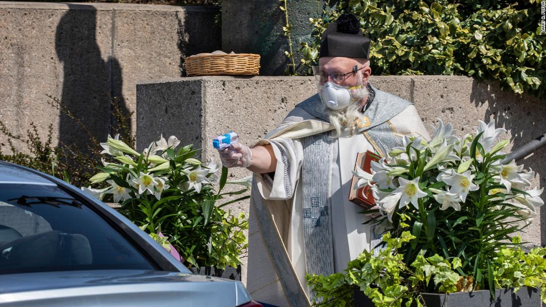 A priest fired holy water through a squirt gun at his congregants. Weeks later, he's gone viral