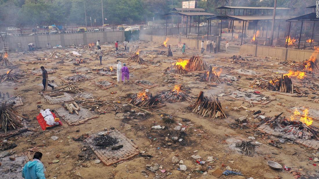 As India's crematoriums overflow with Covid victims, pyres burning through the night