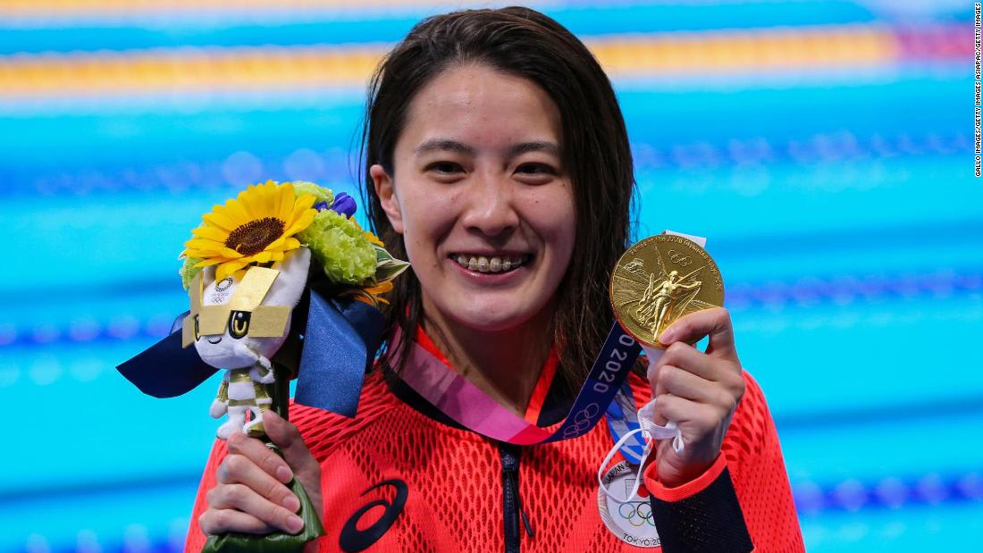 Japanese swimmer hopes gold medal rush can help heal divided nation