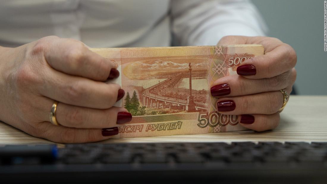 Russia's ruble crashes as its banking system reels from sanctions